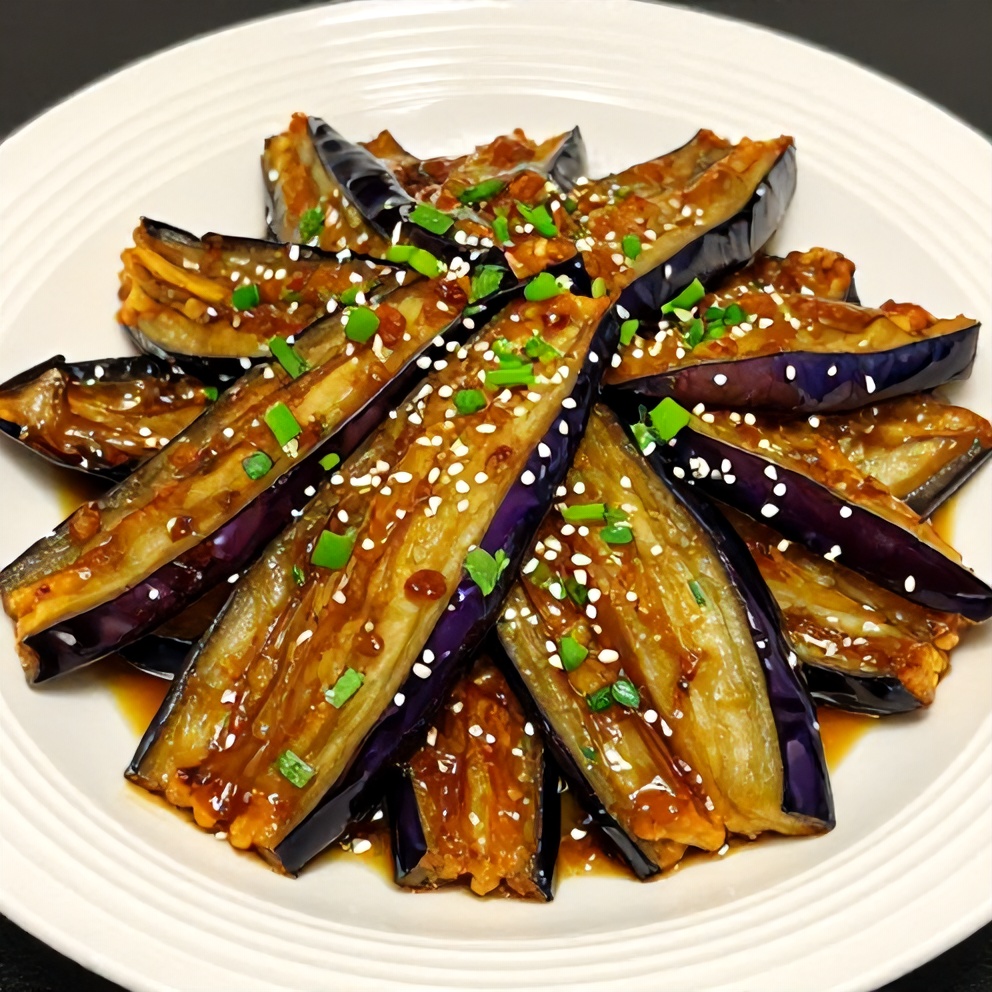 Miso glazed eggplant served on a plate with garnish