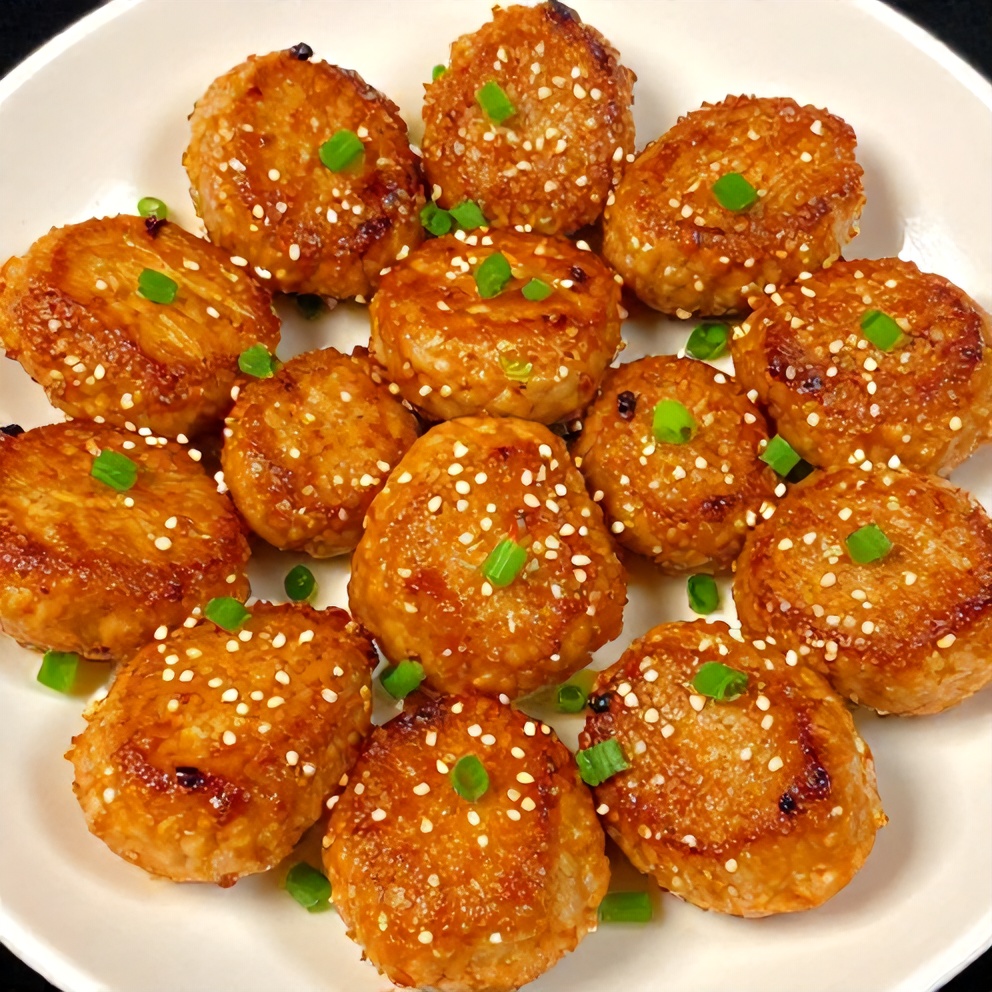 Plated orange teriyaki turkey medallions with green onions