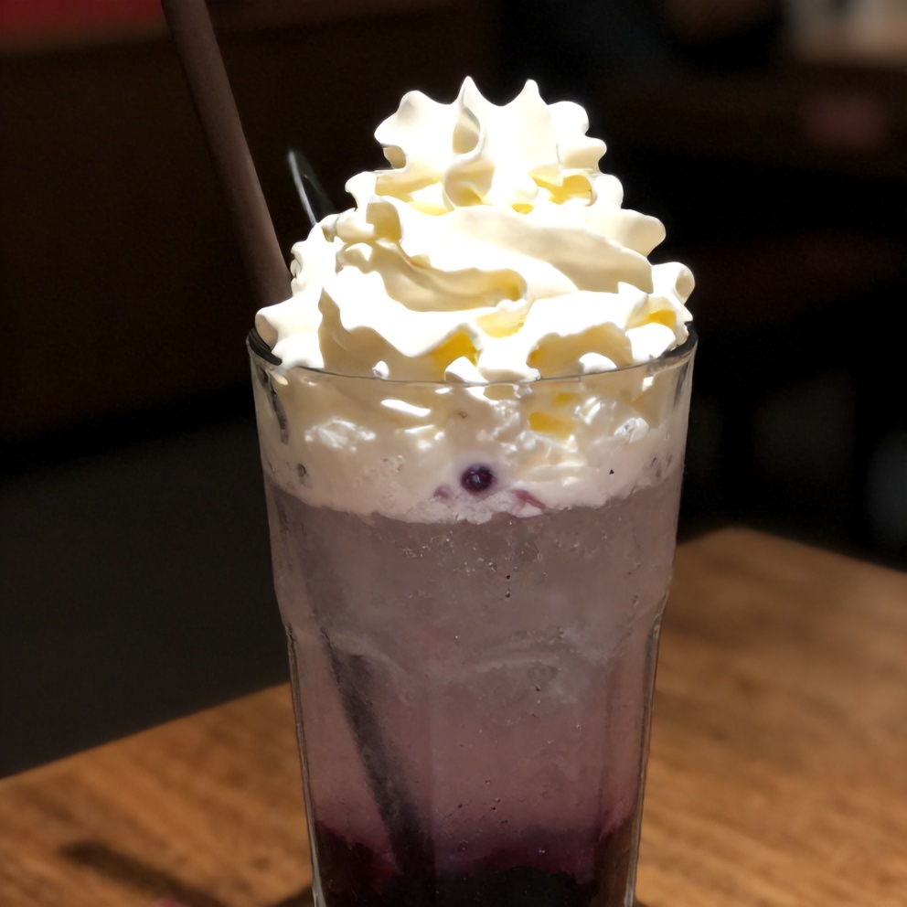 Italian Cream Soda with blueberry syrup and whipped cream