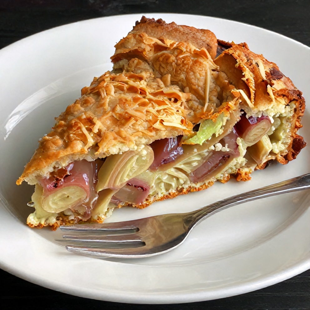 Sliced Easy Rhubarb Cake on a plate with a fork
